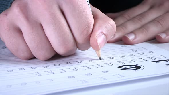 Student Hands Writing