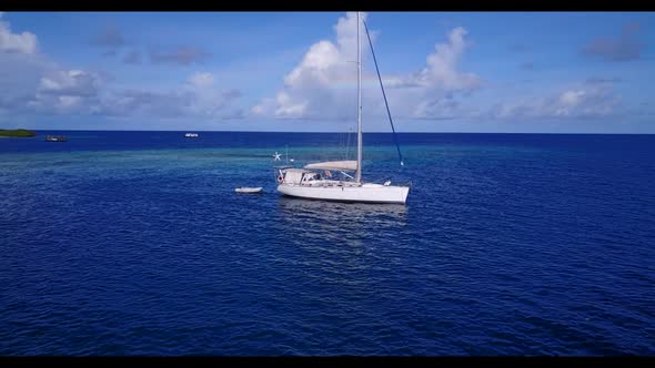 Aerial top view nature of exotic seashore beach adventure by blue ocean and white sand background of