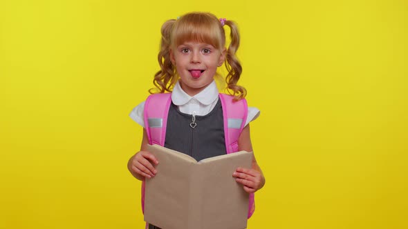 Smiling Schoolgirl Hiding Behind a Book Laugh Fooling Around Making Playful Silly Facial Expressions