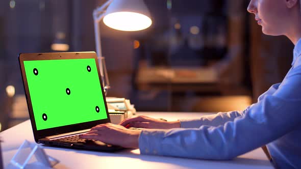 Businesswoman with Green Screen on Laptop at Night 70