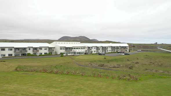 Apartment complex in Grindavik, Iceland with drone video moving up.