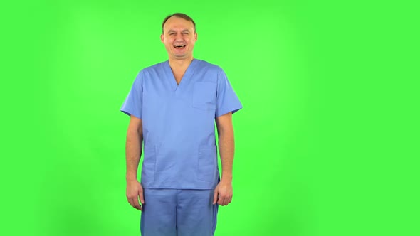 Medical Man Bursting with Laughter Being in Positive Over Green Screen