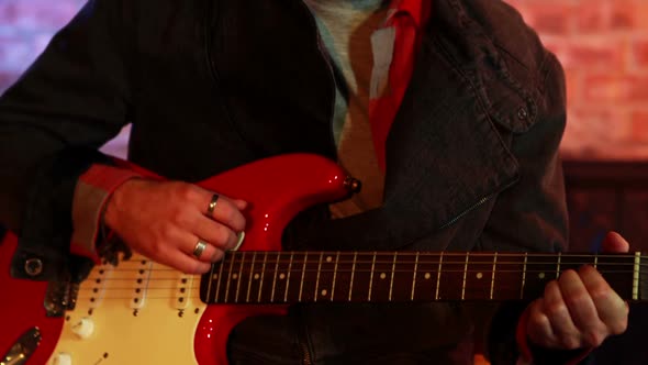 Handsome musician playing guitar