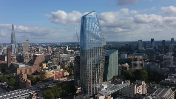 Ascending Footage of One Blackfriars Tall Modern Building with Shiny Glass Facade