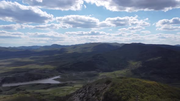 View From Above to the Picturesque Mountain Landscape and the Flowing River