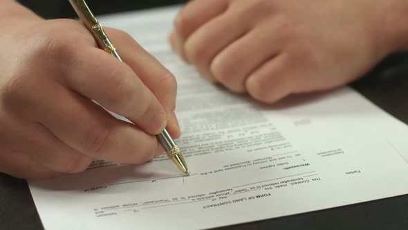 Closeup of Male Hand Signing Contract, Businessman Making Deal