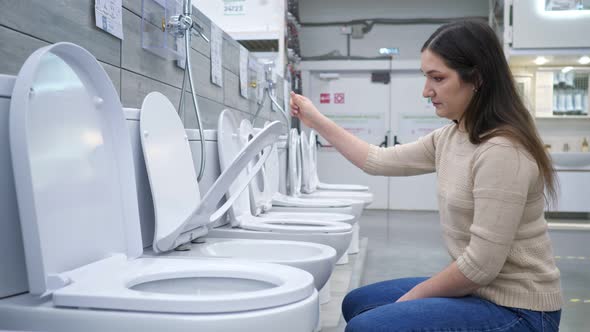 Woman Chooses Toilet Bowl with Seat Lift