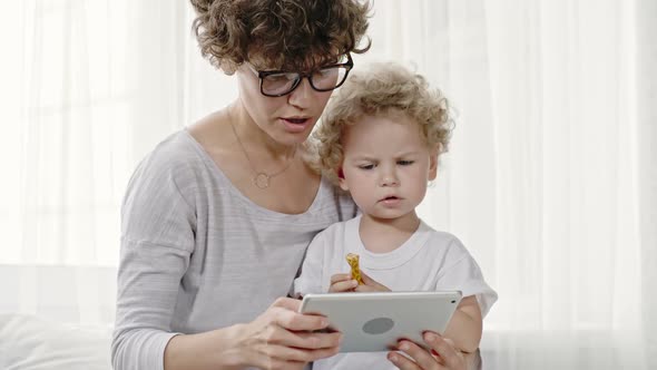 Mother and Toddler Boy with Tablet