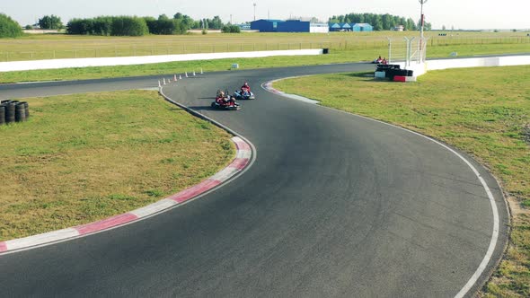 Circuit with Gocarts Racing Through It