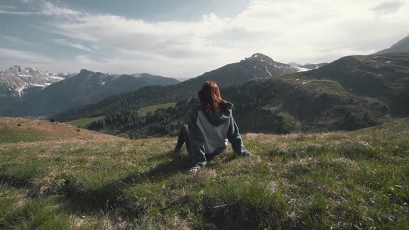 Slow Motion Shot of Happy Young Woman Walks in the Dolomites Mountains Northern Italy in the Summer