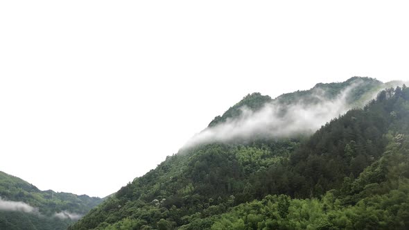 Time-lapse of moving clouds over Chinese Mountains.