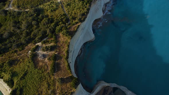 Drone Over Coastline Cliffs And Sea At Sunrise Of Cape Drastis