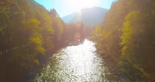 Low Altitude Flight Over Fresh Fast Mountain River with Rocks at Sunny Summer Morning