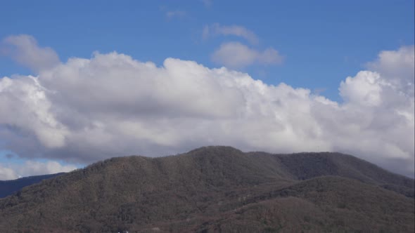 Blue Sky White Clouds Over the Mountains