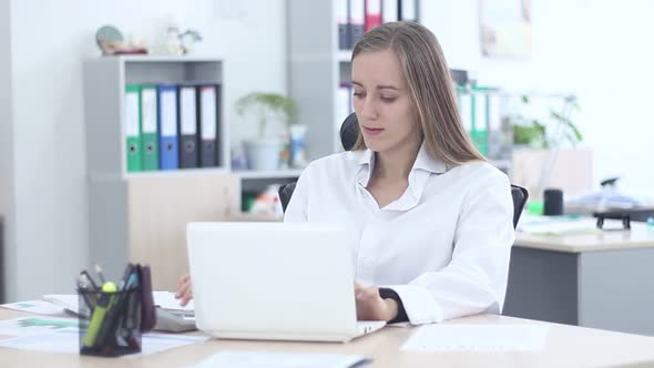 Beautiful Girl Working In The Office