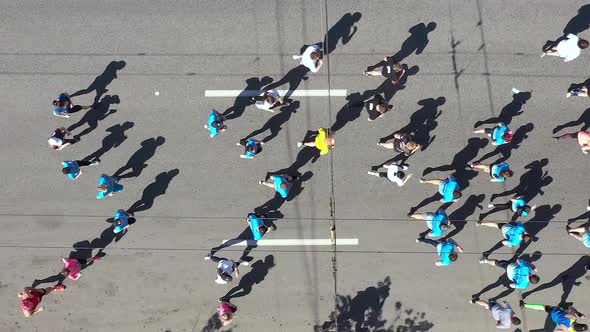 Aerial Group of People Running City Marathon