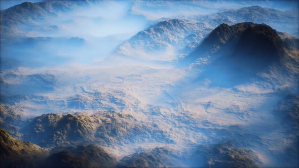 Distant Mountain Range and Thin Layer of Fog on the Valleys alt