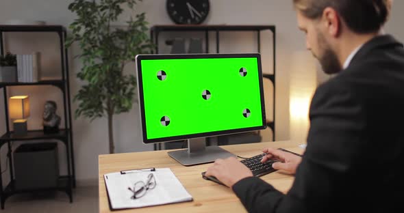 Office Man Working on Computer with Green Screen