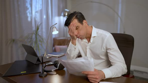 Tired Nervous Man Making Facepalm Gesture Throwing Away Documents