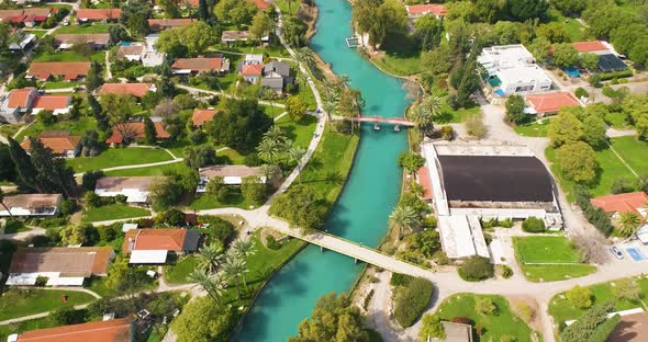 Aerial view of the town with hills in the background and Kibbutzim Stream.