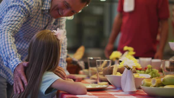 Happy family eating dinner together.