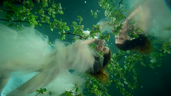 Surreal Underwater Magic Shot Young Beautiful Woman is Swimming in Fabulous Garden