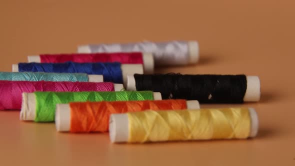 Man put Colorful threads , Sewing threads