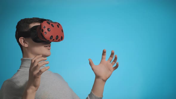 Person Surprised with Virtual Effect in VR Googles Closeup