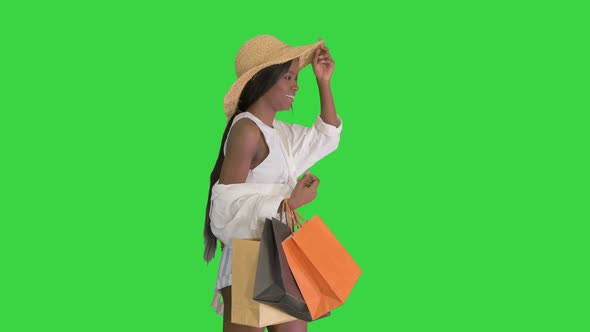 Happy African American Woman Straw Hat Walking Shopping Bags Green Screen Chroma Key