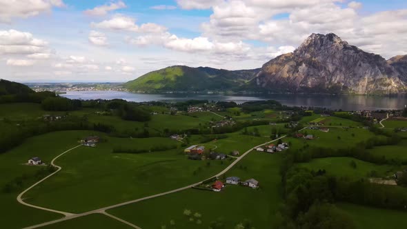 Beautiful view on the Mountains, lake and a Village Drone Video