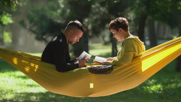 Couple reading in a hammock