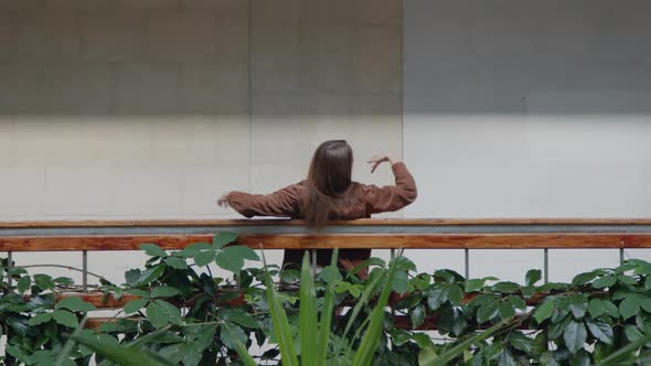 Woman Is Dancing Near Balustrade