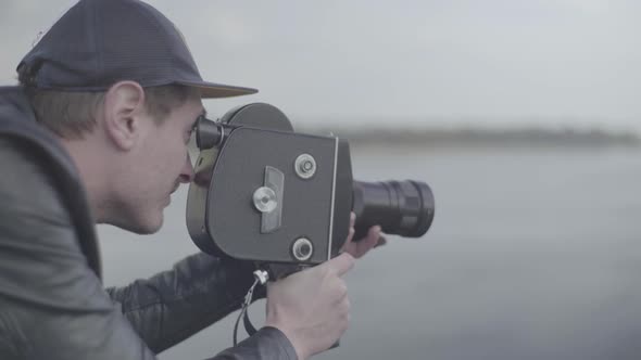 A Male Cameraman Shoots Video on an Old Vintage Camera Krasnogorsk. Kyiv. Ukraine