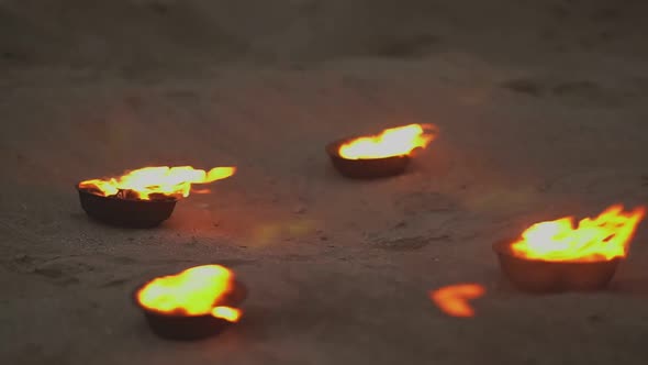 on the Ground There are Bowls of Fire
