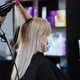 Hands of a hairdresser in rubber hair blow dry a blonde. - VideoHive Item for Sale