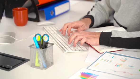 Home office worker using keyboard.