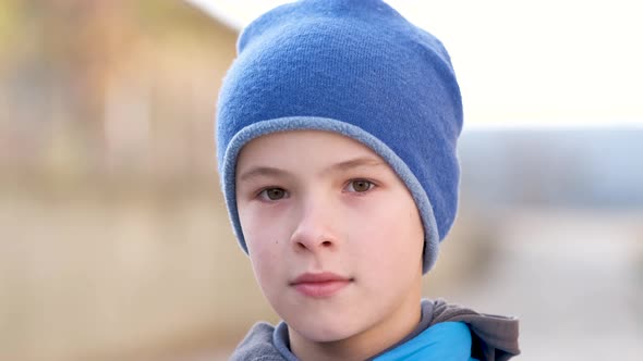 Portrait of Happy Child Boy in Warm Clothes in Autumn Outdoors