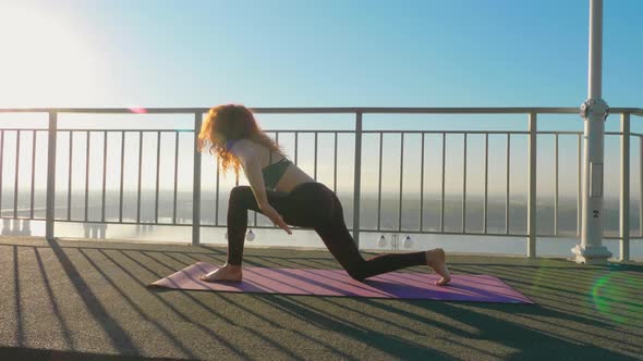 Yoga and Pilates Exercises on the Roof