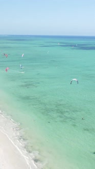 Vertical Video Kitesurfing Near the Shore of Zanzibar Tanzania