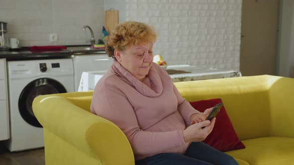 Mature Woman Using Smartphone Texting Browsing Social Media