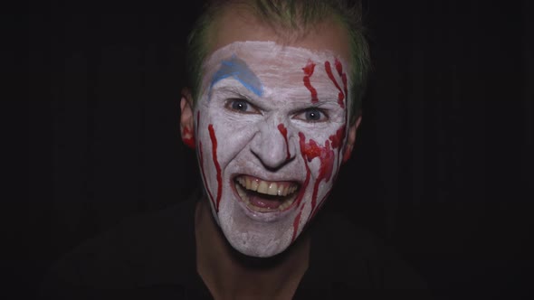 Clown Halloween Man Portrait. Creepy, Evil Clowns Blood Face. White Face Makeup