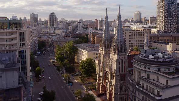 Aerial View of European City with Catholic Church and Car Traffic