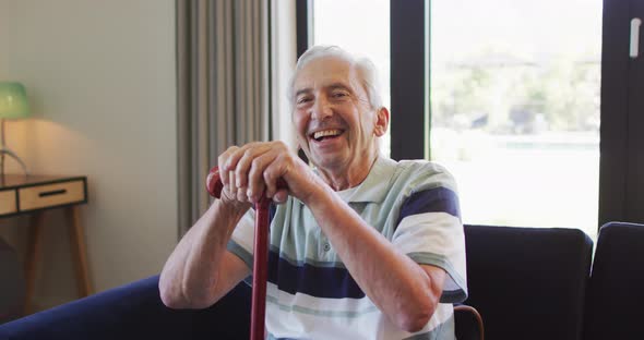 Animation of happy caucasian senior man with walking stick