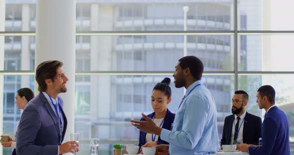 Multi ethnic business people interacting with each other during a seminar 4k