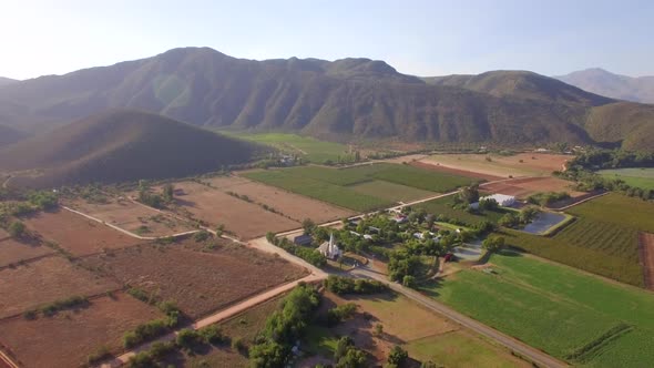 Aerial travel drone view of farms and farming.