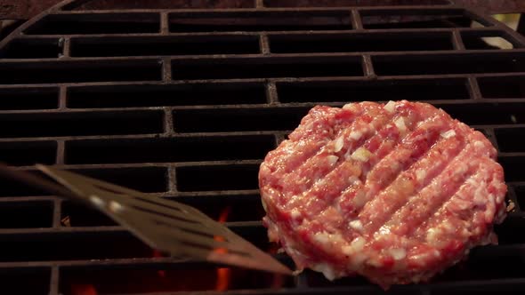 Two Raw Homemade Burger Cutlets Made of Meat are Placed on the Grill