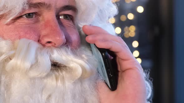 Portrait of Santa Claus Talking on Smartphone