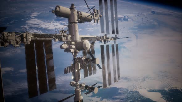 International Space Station in Outer Space Over the Planet Earth alt