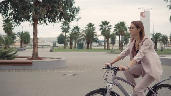 Charming Woman Riding Bicycle