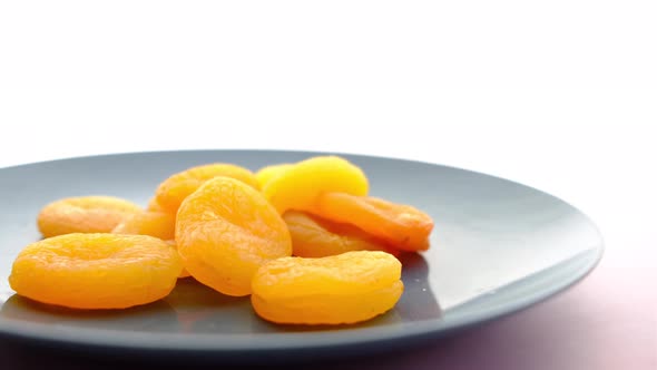Apricot Fruit Half on a Plate on White Background